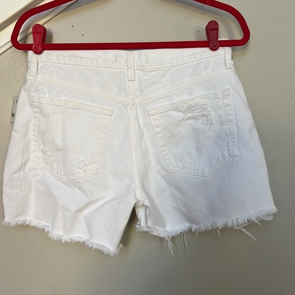 Free People
Maggie Mid Rise Frayed Hem Distressed Denim Shorts. - Picture 7 of 13